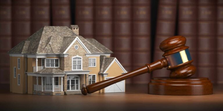 house with gavel and law books real estate law and house aucti
